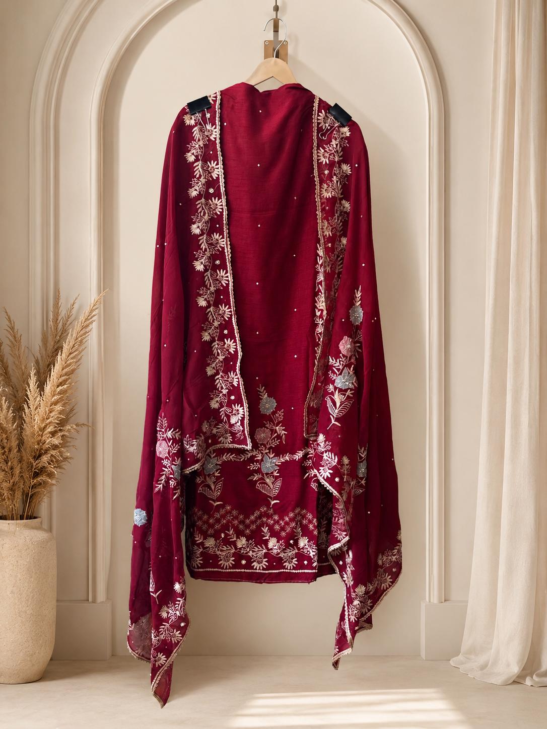 Luxurious unstitched heavy maroon embroidered suit designed for sophisticated party
