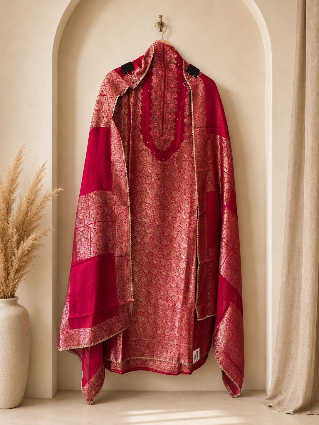 Luxurious unstitched rani pink suit crafted for discerning celebrations