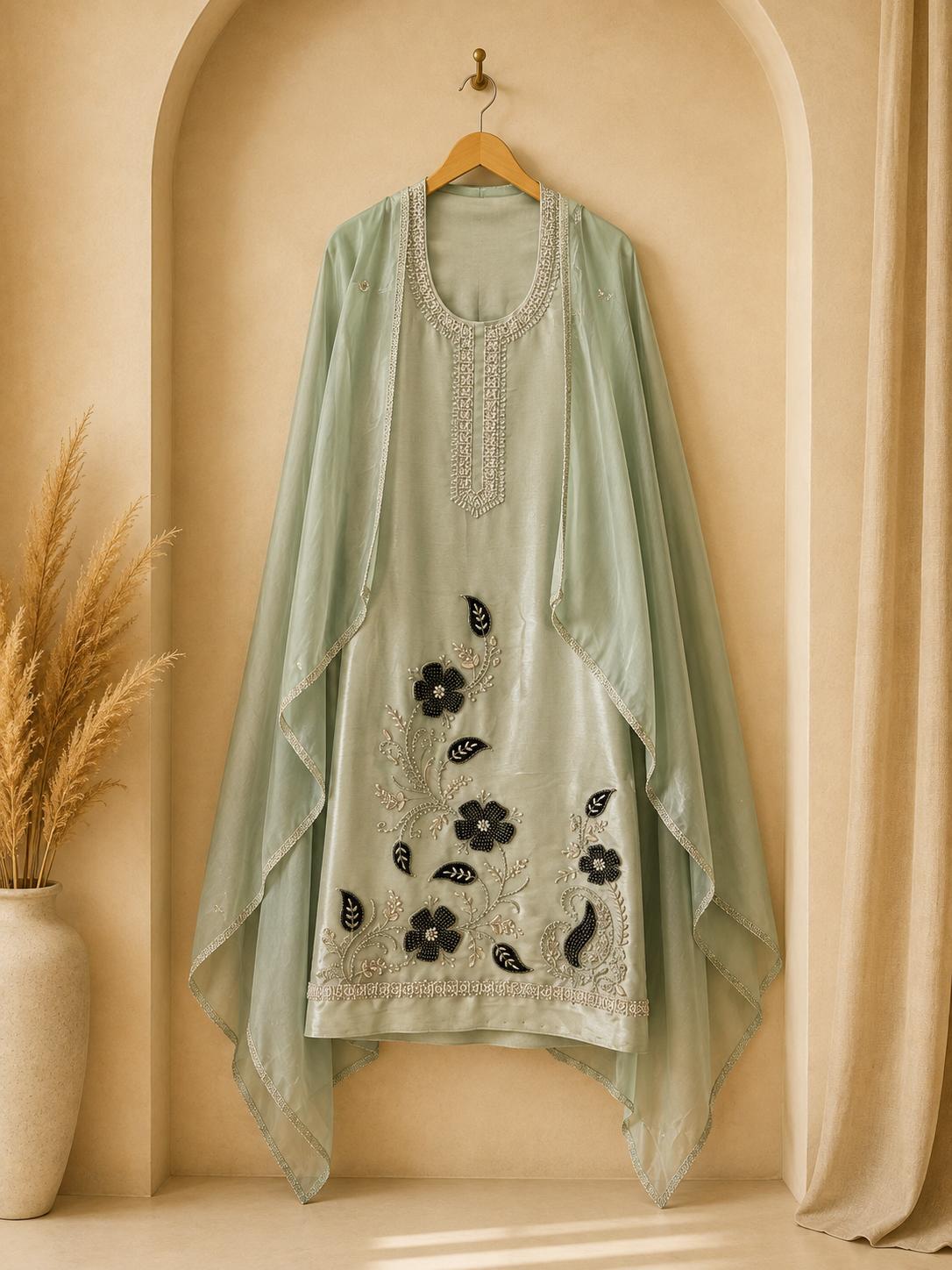 Luxurious unstitched green floral design suit crafted for discerning celebrations